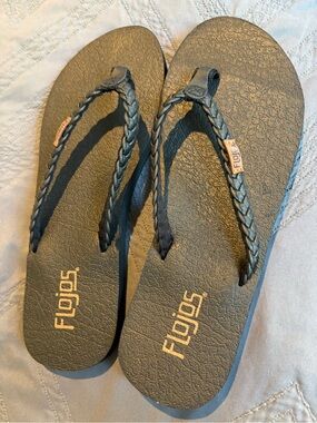 Flojos Braided Strap Flip Flops in Black with Gold Logo